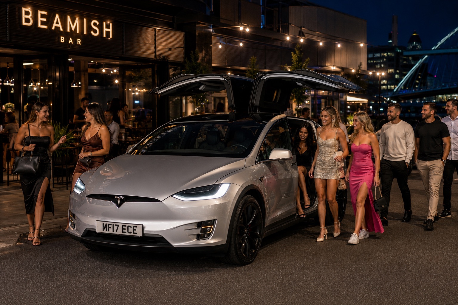 A group of friends stepping out of a silver Tesla Model X with its Falcon Wing doors raised outside a Newcastle quayside bar at night.